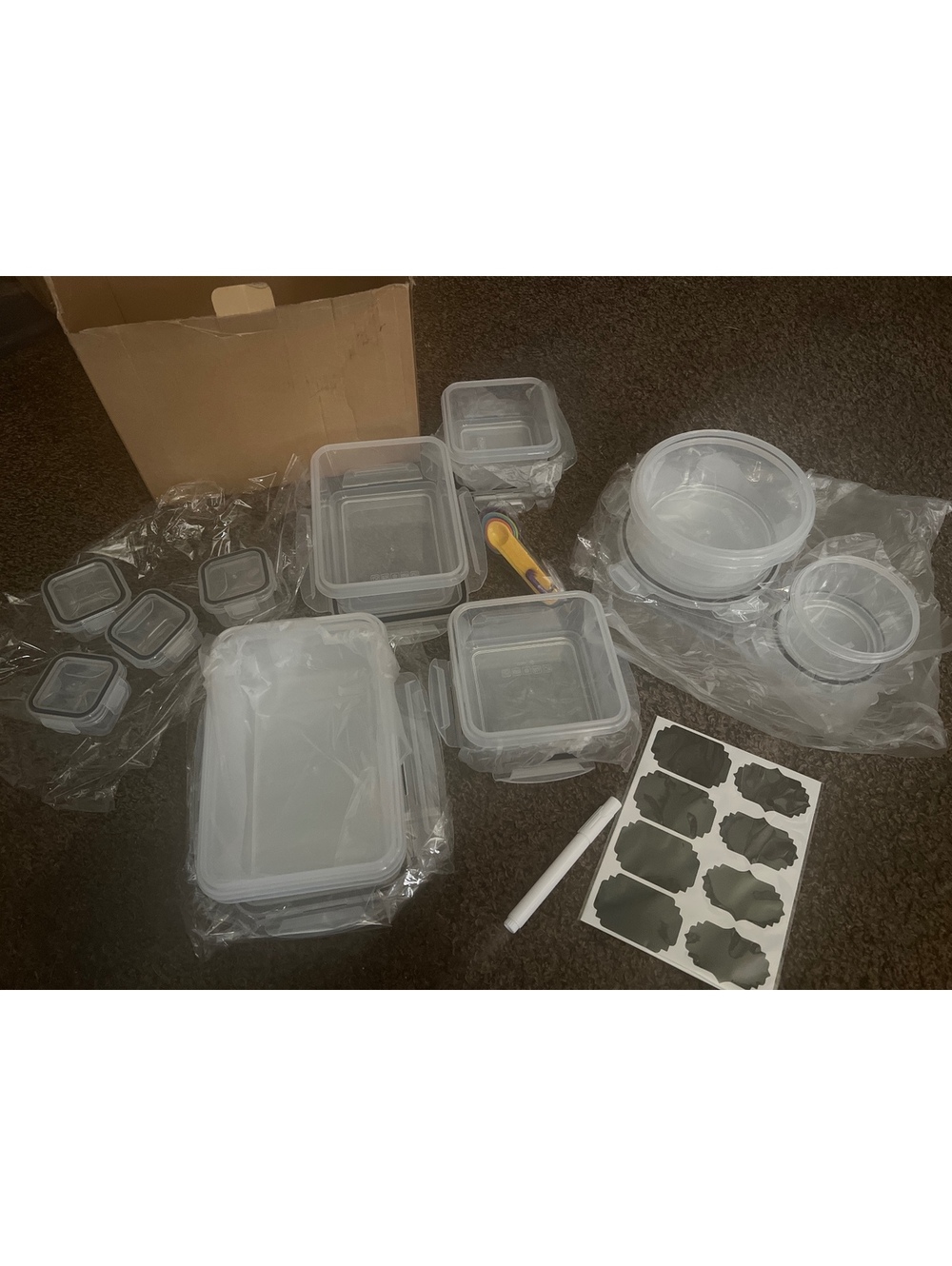 Set of Various Plastic Food Storage Containers with Labels and Measuring Spoons